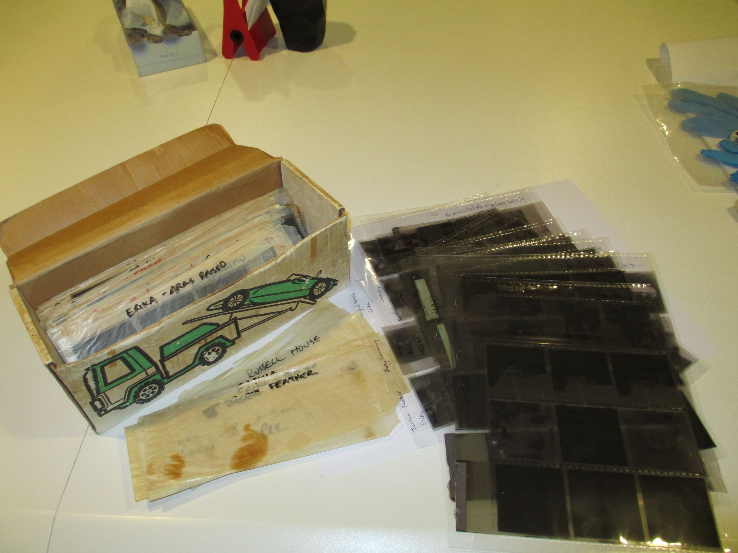 <p>Medium format negatives in the archive before and after accessioning. Photo: Caroline McBride. E H McCormick Research Library, Auckland Art Gallery Toi o Tāmaki</p>
