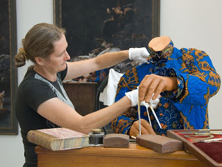 <p>Textile conservator, Tracey Wedge, cleaning the fabric on&nbsp;The Age of Enlightenment - Jean le Rond d&#39;Alembert&nbsp;to ensure it is spotless for the opening.</p>
