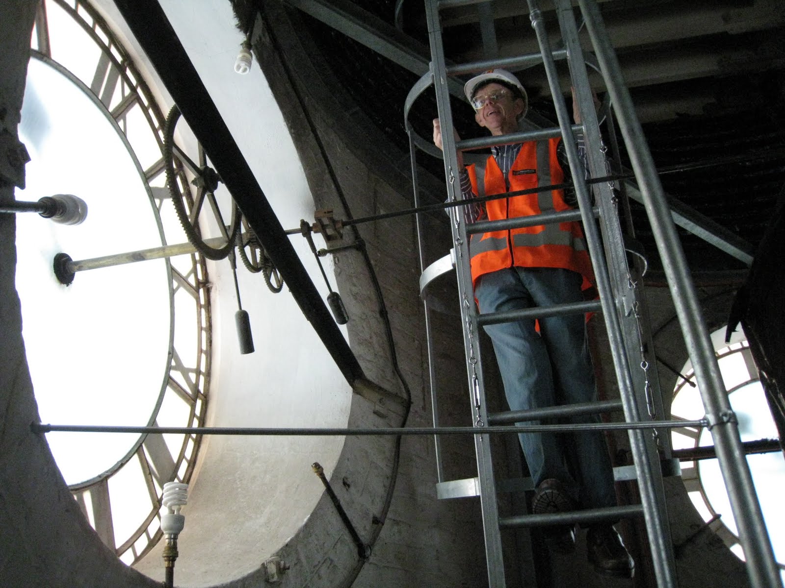 <p>Climbing down the new ladder from the bell tower past the back of the clock face.</p>
