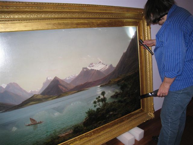 <p>Checking the painting&#39;s condition</p>