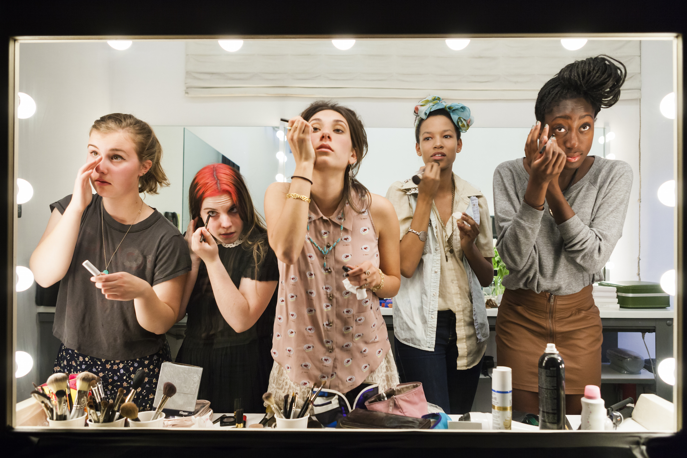 <p><strong>Lauren Greenfield</strong>, <em>High school seniors (from left) Lili, 17, Nicole, 18, Lauren, 18, Luna, 18, and Sam, 17, put on their makeup in front of a two-way mirror for Lauren Greenfield&#39;s Beauty CULTure documentary, Los Angeles</em>, 2011. From the series Generation Wealth, &copy; Lauren Greenfield.</p>

