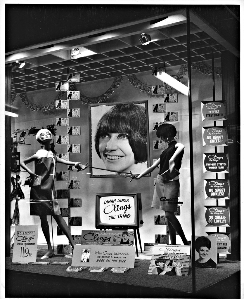 <p>Minis made legs the focus of attention. Dinah Lee became the voice of Holeproof &lsquo;Clings&rsquo; in their television advertising and in this window at H &amp; J Court department store on Hamilton&rsquo;s Victoria Street. Image from the John Millar collection, Hamilton City Libraries &ndash; HCL_14607</p>