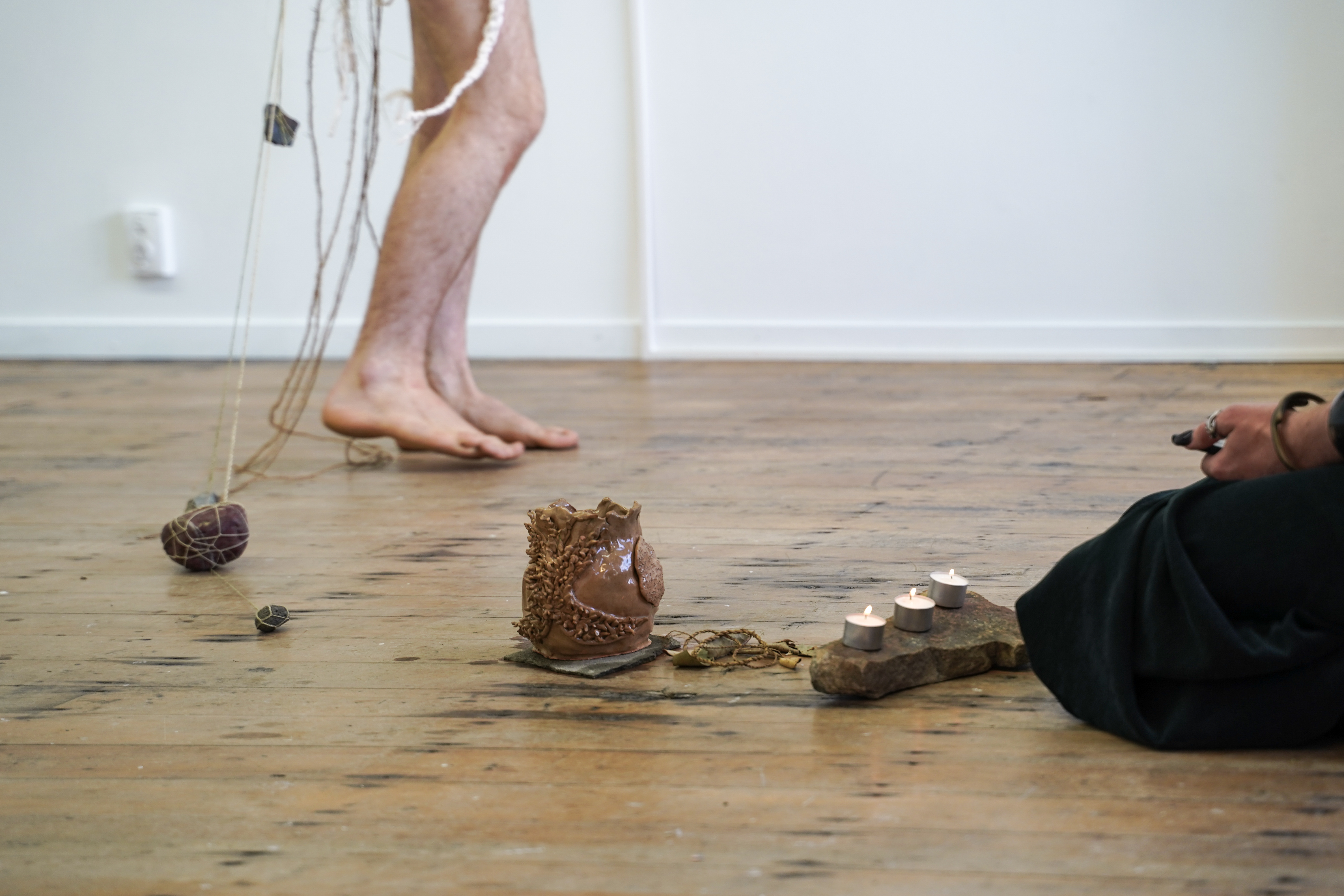 <p>Connor Fitzgerald and Louie Zalk-Neale, <em>GLOSSY LEAF Kiss, I dug a hole and they sprinkled sand in it</em>, 2021 (performance detail), Blue Oyster Art Project Space, Dunedin. Image courtesy of the artist and Blue Oyster Art Project Space. Photograph: Bunty Bou</p>
