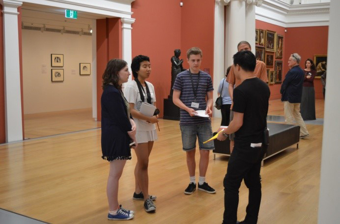 <p>Interns in the historic Mackelvie Gallery with Gallery Assistant Benny Chan</p>