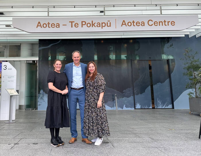 Collective Hospitality’s Sally Tau (left) and Queeny Guo plus Richard Dodds from ACVE standing in front of Aotea Centre. 