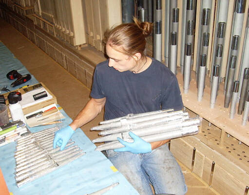 <p>Laying out some of the 5,291 organ pipes</p>

