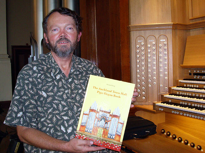 <p>Dr John Wells, Auckland City Organist 1998 - 2012, initiated the campaign that led to the 2010 Klais organ. He displays the children&#39;s book &quot;The Auckland Town Hall Pipe Organ Book&quot; which was published to mark its inauguration.</p>
