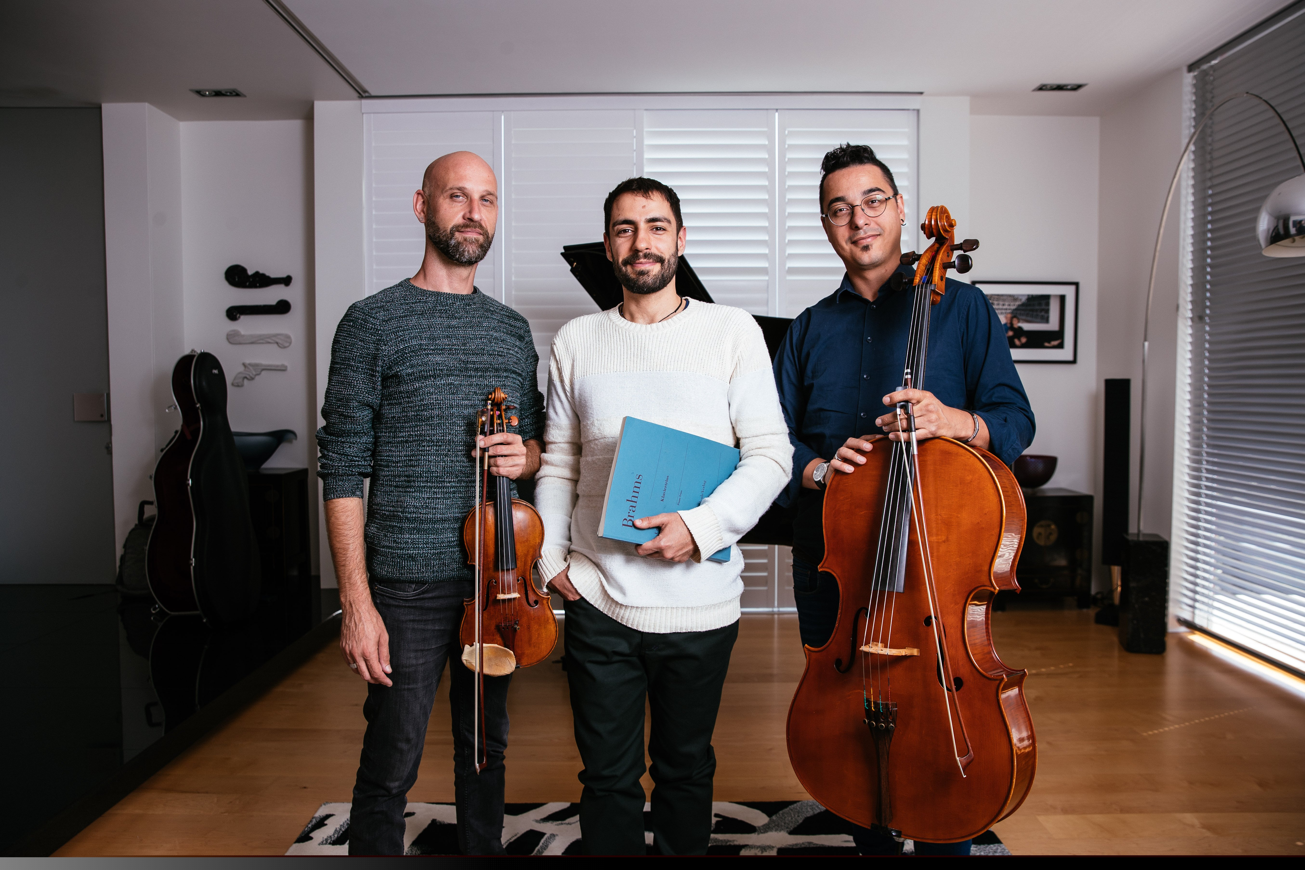 Orion Piano Trio - three members holding instruments