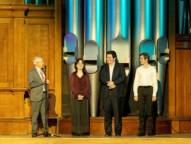 <p>Chairman of the Auckland Town Hall Organ Trust, Kerry Stevens, introducing the fabulous young organists of November&#39;s Rising Stars concert: Gloria Lee, Max Toth and Jaime Taylor. Photo by Hans Weichselbaum.</p>
