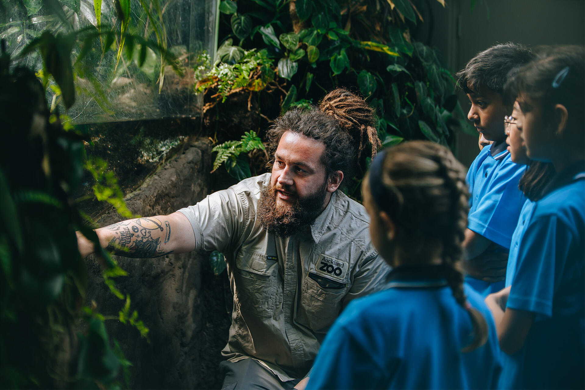 https://cdn.aucklandunlimited.com/zoo/assets/media/conservation-learning-facilitator-koha-kahui-mcconnell-in-a-teaching-session-at-the-zoos-swamp-forest-habitat-2.jpg