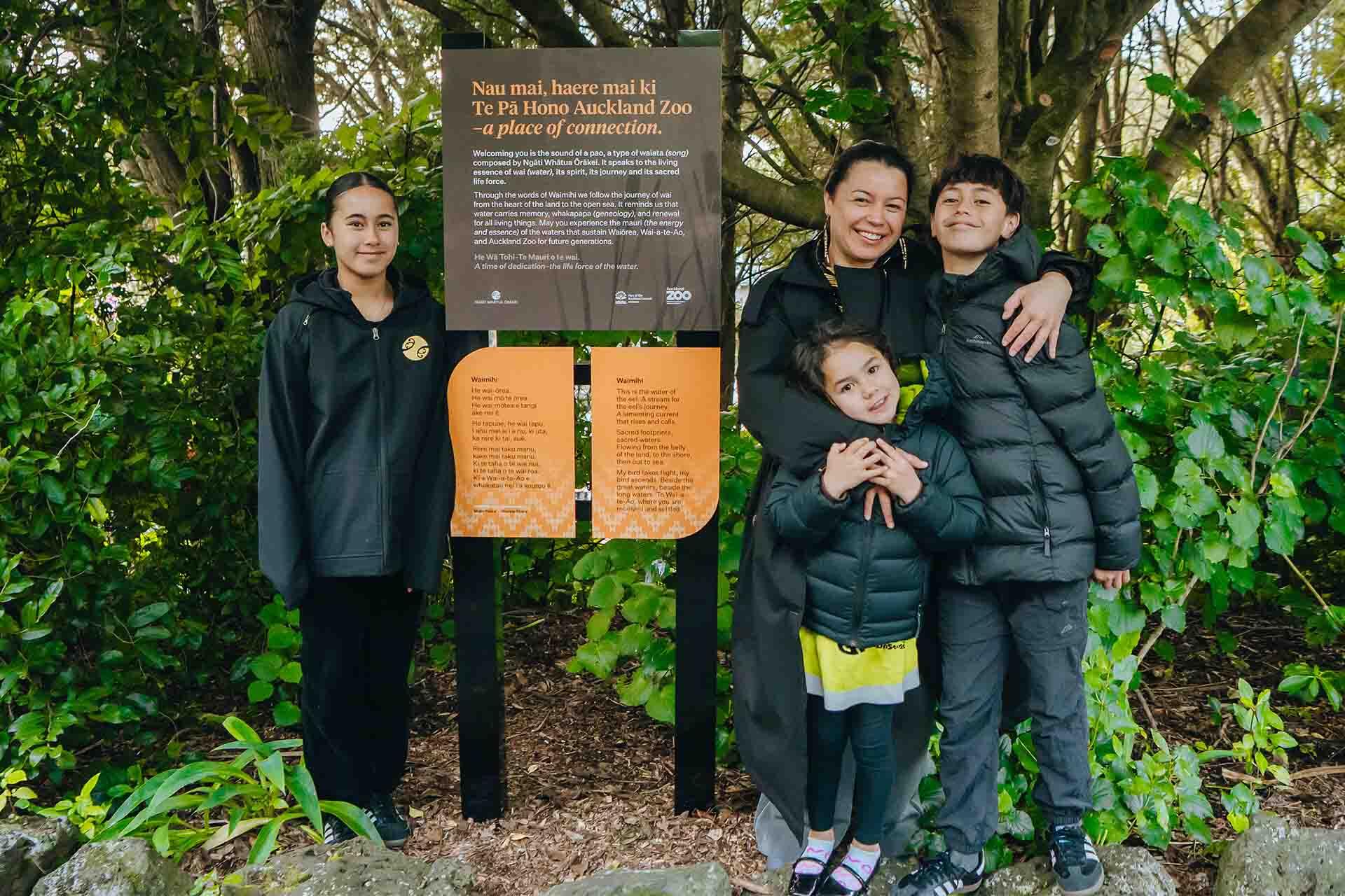 https://cdn.aucklandunlimited.com/zoo/assets/media/majic-paora-with-her-whanau-and-the-soundscape-sign.jpg