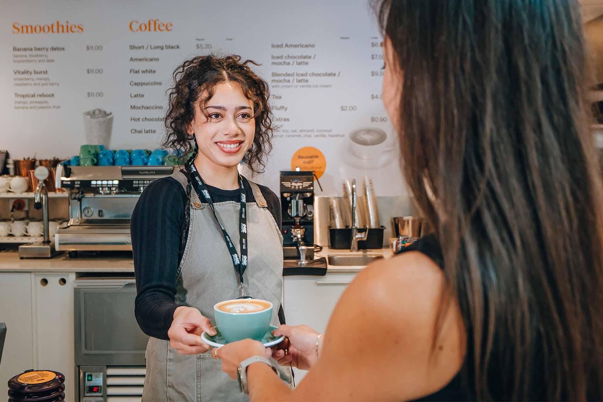 https://cdn.aucklandunlimited.com/zoo/assets/media/purchasing-coffee-at-te-puna-cafe.jpg